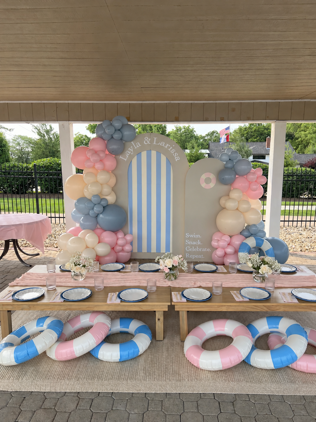 Pastel pool party backdrops and low tables