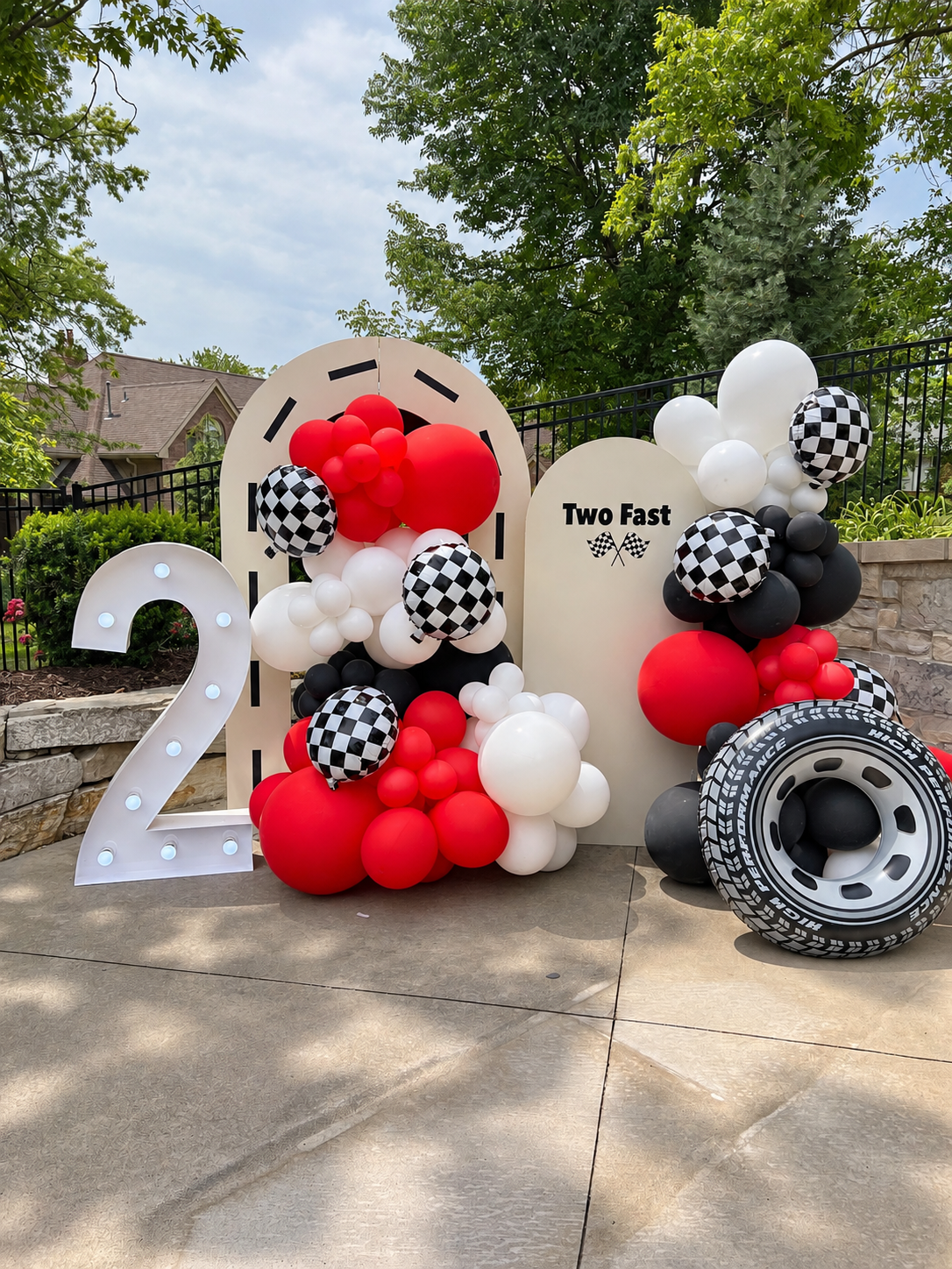 Red black and white racing birthday backdrop with marquee two